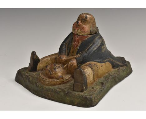 A 19th century cold painted cast iron inkwell, as a portly gentleman carving a roast chicken, hinged cover, 17cm wide
