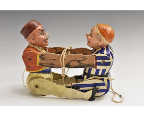 A 19th century polychrome softwood and gesso articulated caricature toy, as a pair of wrestling figures, each colourfully dre