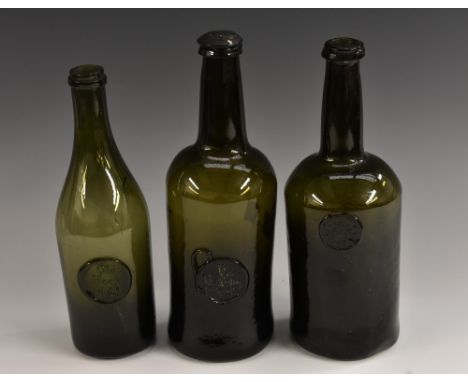 A George III olive green glass sealed wine bottle, R Mofeley [Moseley] 1792, kick-up base, 28cm high; others, Ja Oakes, Bury 