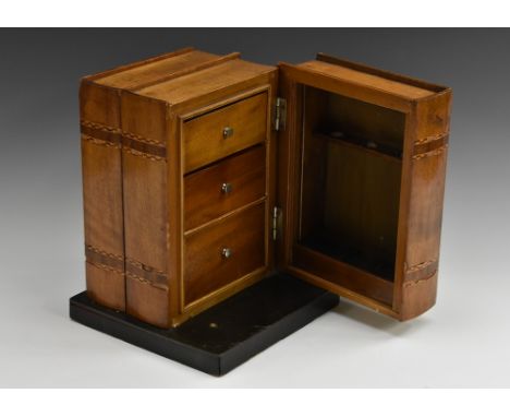 A novelty 'disguise' humidor, as a shelf of books, the hinged side enclosing three small drawers and provision for pipes, rec