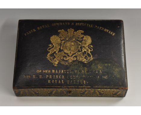 A Victorian tooled and gilt leather rectangular box, hinged cover with Royal coat of arms and inscribed Under Royal Command &