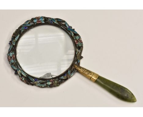 A Chinese spinach jade and champleve enamel magnifying glass, the circular lens with a border of leaves and flowers, 12cm lon