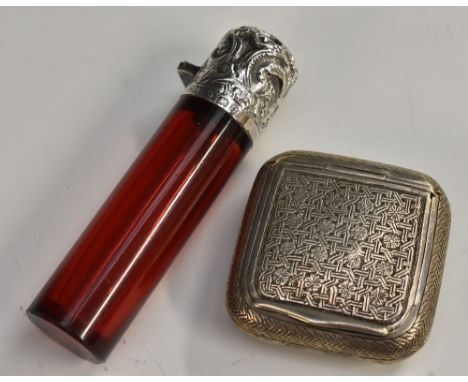 A Persian silver rounded square snuff box, chased in the Islamic taste with a field of geometric knots terminating in flowerh