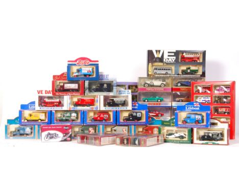 A mixed collection of 30 + assorted  scale diecast model vehicles by Dinky, Matchbox, Lledo and Corgi to include; Dinky 1955 