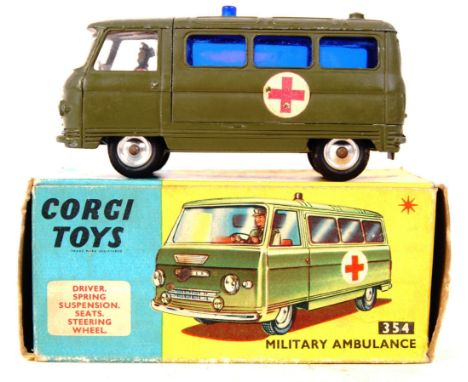 An original vintage Corgi Toys made diecast model No. 354 ' Military Ambulance ' .Green with red cross decals. Good+ to very 