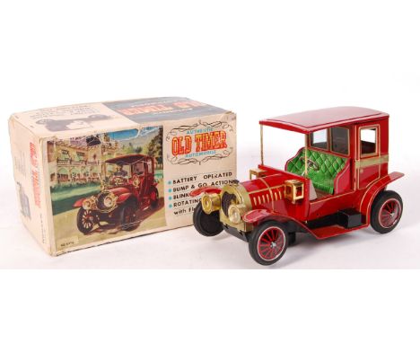 A vintage Japanese made tinplate battery operated ' Authentic Old Timer Automobile ' toy model car ' 8401 Maroon '. Within it