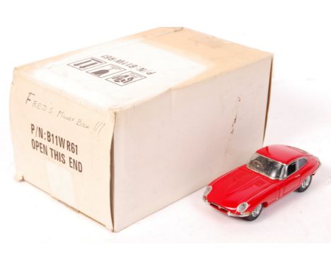 A Franklin Mint made 1:24 scale diecast model E Type Jaguar. Red. Appears mint, likely only ever displayed. Within the origin