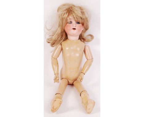An antique early 20th century Armand Marseille German doll. Bisque head, with composition jointed limbs. Largely in very good