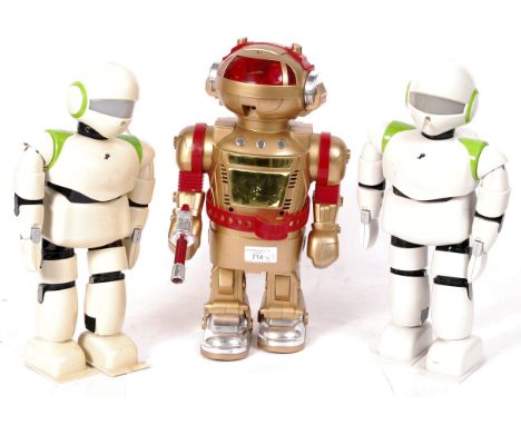 A collection of 3x battery operated robots. To include; 2x ' Pino Robot ' robots by Radica - both interactive with lights and