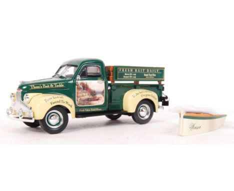 An original Ertl Collectibles 1:24 scale precision diecast model 1947 Studebaker &amp; Fishing boat ' Thom's Bait Tackle '. A