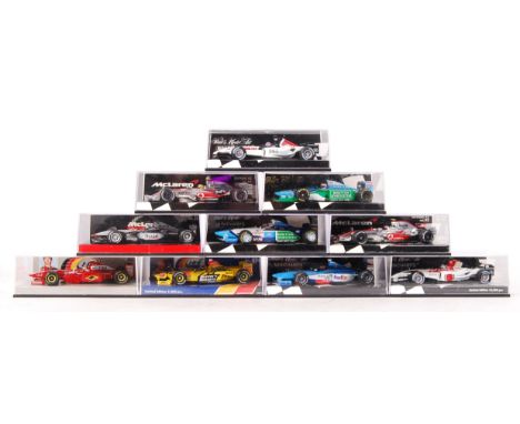 A collection of 10x Minichamps made 1:43 scale precision diecast model Formula One racing cars. All appear mint, unused, with