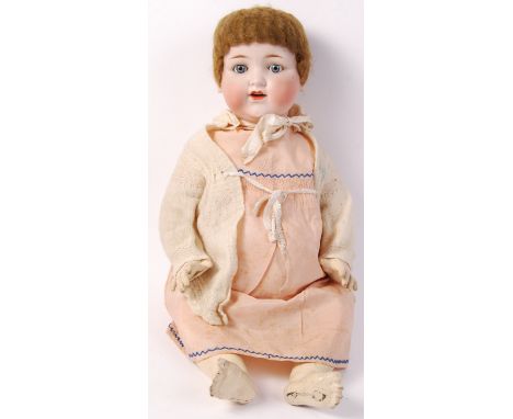 An antique later 19th / early 20th century Armand Marseille doll / dolly. Bisque head, with sleeping eyes. Composition body. 