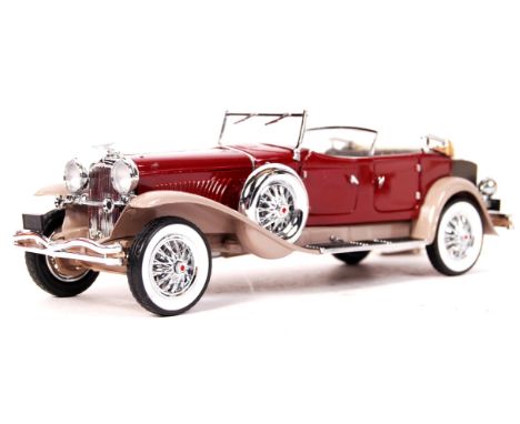 A Franklin Mint made precision diecast model 1:24 scale ' 1930 Duessenberg '. Red, with grey interior. Appears mint, within i