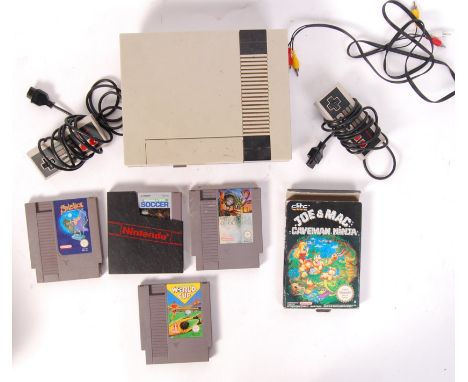 An original vintage Nintendo Entertainment System NES games console. Appears to be complete with: power supply, two controlle