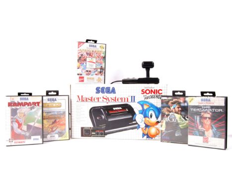 An original vintage Sega Master System II games console. Appears complete, with all leads etc. Along with instructions, joyst
