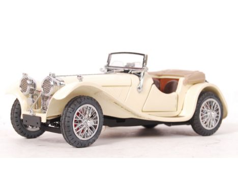 A Franklin Mint made precision diecast model 1:24 scale ' 1938 Jaguar SS 100 '. White, with black/brown interior. Appears min