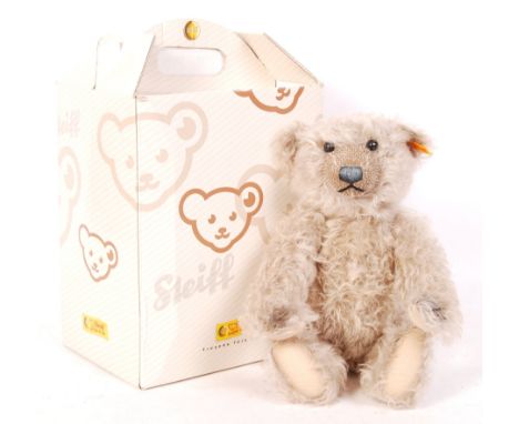 A Steiff made teddy bear - 000553 - brown and white highlight mohair, with inset glass eyes. Tag to ear. No certificate prese