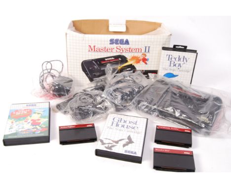 An original vintage Sega Master System II games console - appears to be complete, and was apparently little-used, with all co