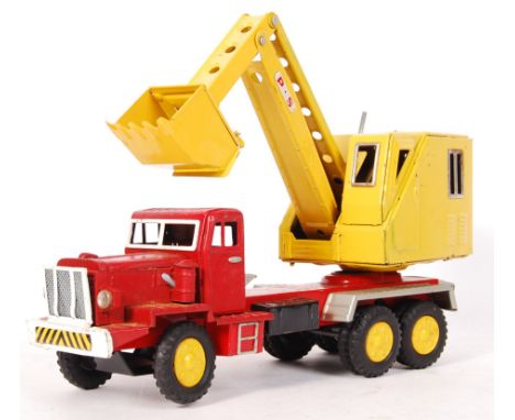 An original vintage SSS Toys Japanese made pressed tinplate digger lorry comprising of a red lorry / truck with a digger atta