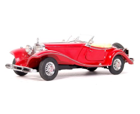 A Danbury Mint 1:24 scale precision diecast model ' 1935 Mercedes Benz 500K Roadster ' car. Red, with yellow interior, and si