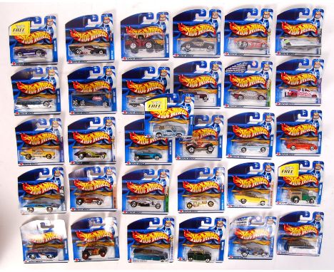 A collection of 32x assorted Hot Wheels carded diecast model cars by Mattel. Largely from the 2002 series. All appear mint an