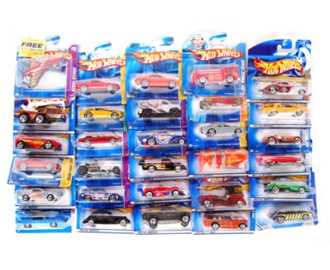 A collection of 30x assorted Hot Wheels carded diecast model cars by Mattel. Largely from early 2000's series. All appear min