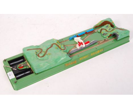 A charming rare vintage Tri-ang / Triang made ' Minic Railway ' (approx 000 scale) battery operated railway train set. Appear