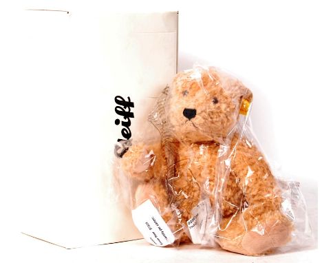 A 20th century Steiff teddy bear ' Elmar 32 '. Long brown mohair, with pronounced nose and glass eyes, complete with ear tag.