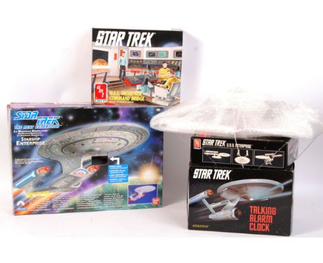 A collection of assorted Star Trek memorabilia, toys and models. To include; a Star Trek ' Talking Alarm Clock, AMT ERTL USS 