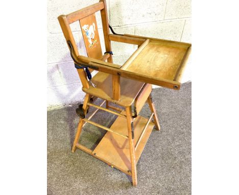 A vintage high chair, with folding top