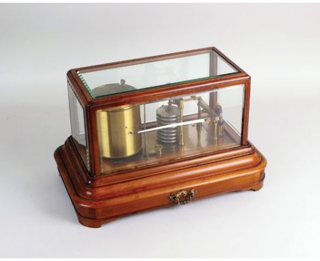 A late Victorian mahogany cased barograph, the bevelled five glass case enclosing a clockwork recording mechanism and steel s