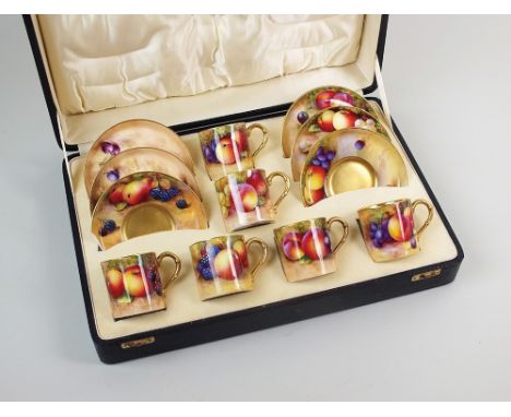A Royal Worcester fruit painted cased coffee service, 1934/35, comprising six coffee cans and saucers painted with fruit by v