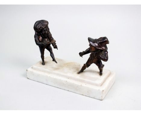 A French bronze group of fighting dwarves, 19th century, the hunchback figures holding a knife and a spoon respectively on a 