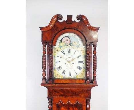 A mahogany longcase clock, second quarter 19th century, the hood with broken scroll pediment above an arched glazed door, fla