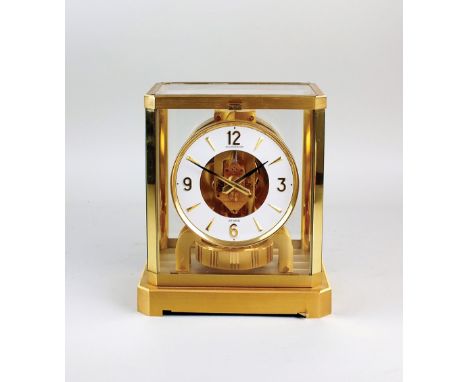 A Jaeger-le-Coultre Atmos clock, late 20th century the five glass polished brass case enclosing a round white dial with Arabi