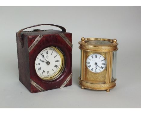 Elliott and Son, London; a gilt brass carriage timepiece with a 4cm circular white enamel dial and Roman numerals within an o
