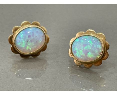 9ct gold opal stud earrings with rubbed over setting