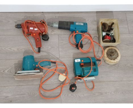 Collection of vintage black and decker tools including drills and sanders with some accessories