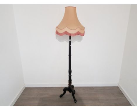 Mahogany pedestal standard lamp with fringed shade