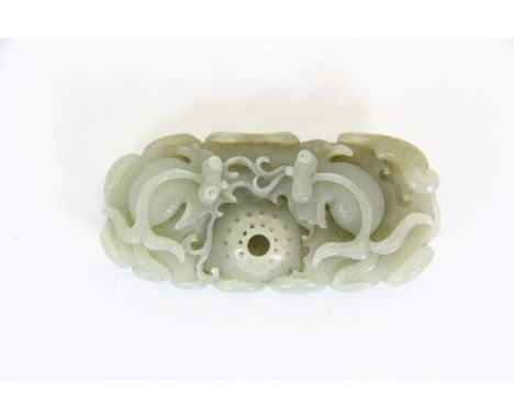Very finely carved pale green jade brush washing bowl in the form of 2 koi carp around a fishing net