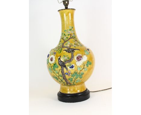 A 19th century Chinese relief decorated porcelain vase mounted as a table lamp H 50cm (without shade) A/F to base