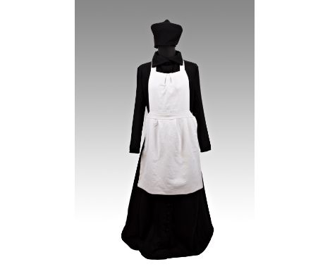 MAIDâ€™S DRESS | EUROPE | 20th century | 156 cm (height) | Woven fabric | Provenance: private pharmacy museum | Bidders are a