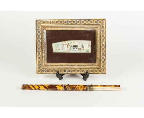 INDIAN MINIATURE PAINTED ON IVORY, of shaped oblong form, painted in colours and depicting a family outside a tent1 3/8" x 4 