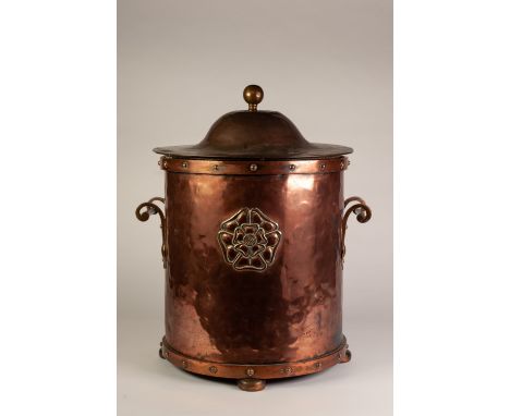 ARTS AND CRAFTS TWO HANDLED PLANISHED COPPER COAL RECEIVER WITH COVER, of cylindrical from with bar and scroll handles, studd
