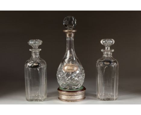 MODERN PEAR-SHAPE CUT GLASS DECANTER WITH SILVER COLLAR AND MATCHING WINE LABEL and SILVER COASTER, together with SEVEN OTHER