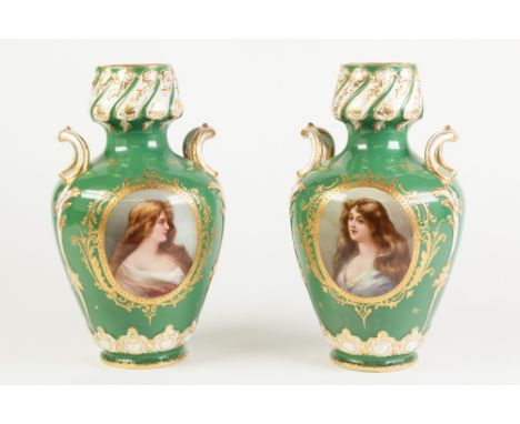 PAIR OF ROYAL BONN HAND PAINTED TWO HANDLED PORCELAIN VASES, each of ovoid form with crll handles to the waisted neck, decora