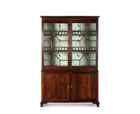 A D.Maria cupboardRosewood and other woodsTwo glazed doors to upper sectionInner drawers and galleried shelfTwo doors to lowe
