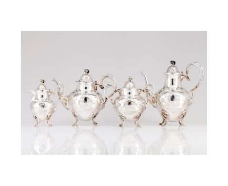 A tea and coffee setComprising of teapot, coffee pot, sugar bowl and milk jugSilver 833/000Neoclassical reliefs decorationOpo