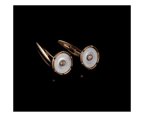 A pair of cufflinksGoldApplied mother-of-pearl element set with 2 antique brilliant cut diamonds totalling approximately 0,20