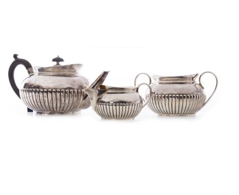 VICTORIAN SILVER THREE PIECE TEA SERVICE, maker Hukin & Heath, Birmingham 1886, comprising teapot, sugar and cream, each of c